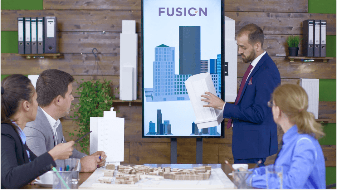 Architect presents building model during Fusion meeting